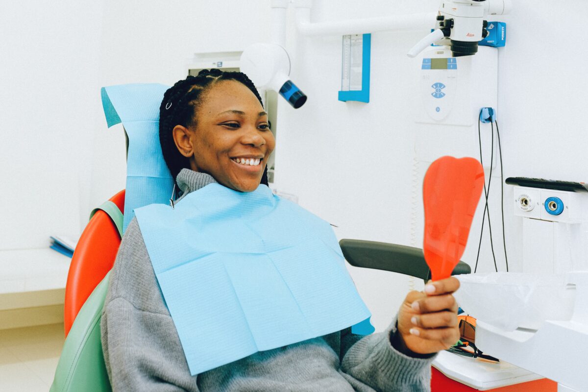 Care for your teeth : Image showing happy woman at the dental clinic