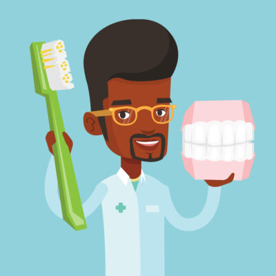 Dental examination and consultation : Image showing African male dentist with a jaw model and a toothbrush